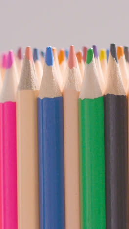 Vertical-Video-Studio-Shot-Of-Rotating-Multi-Coloured-Pencils-Against-White-Background-2